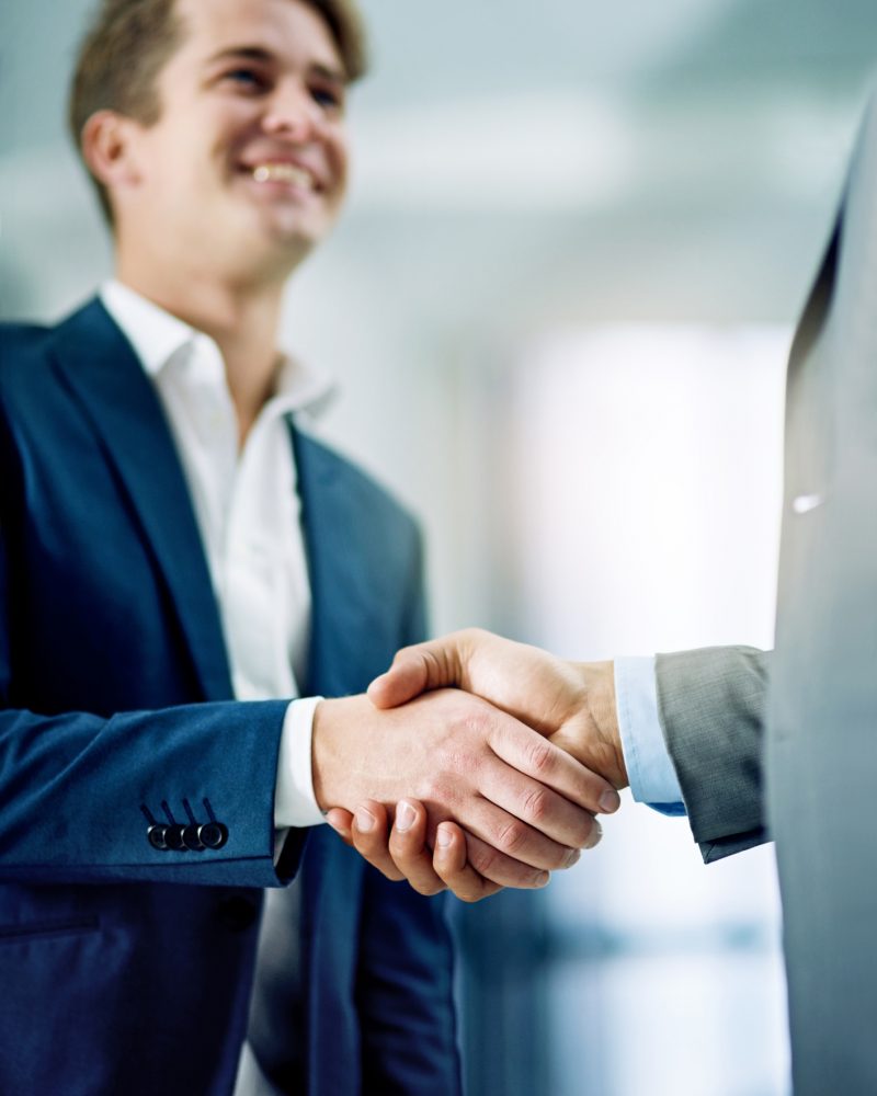 I’d say we have a deal then Cropped shot of two businessmen shaking hands in an office
