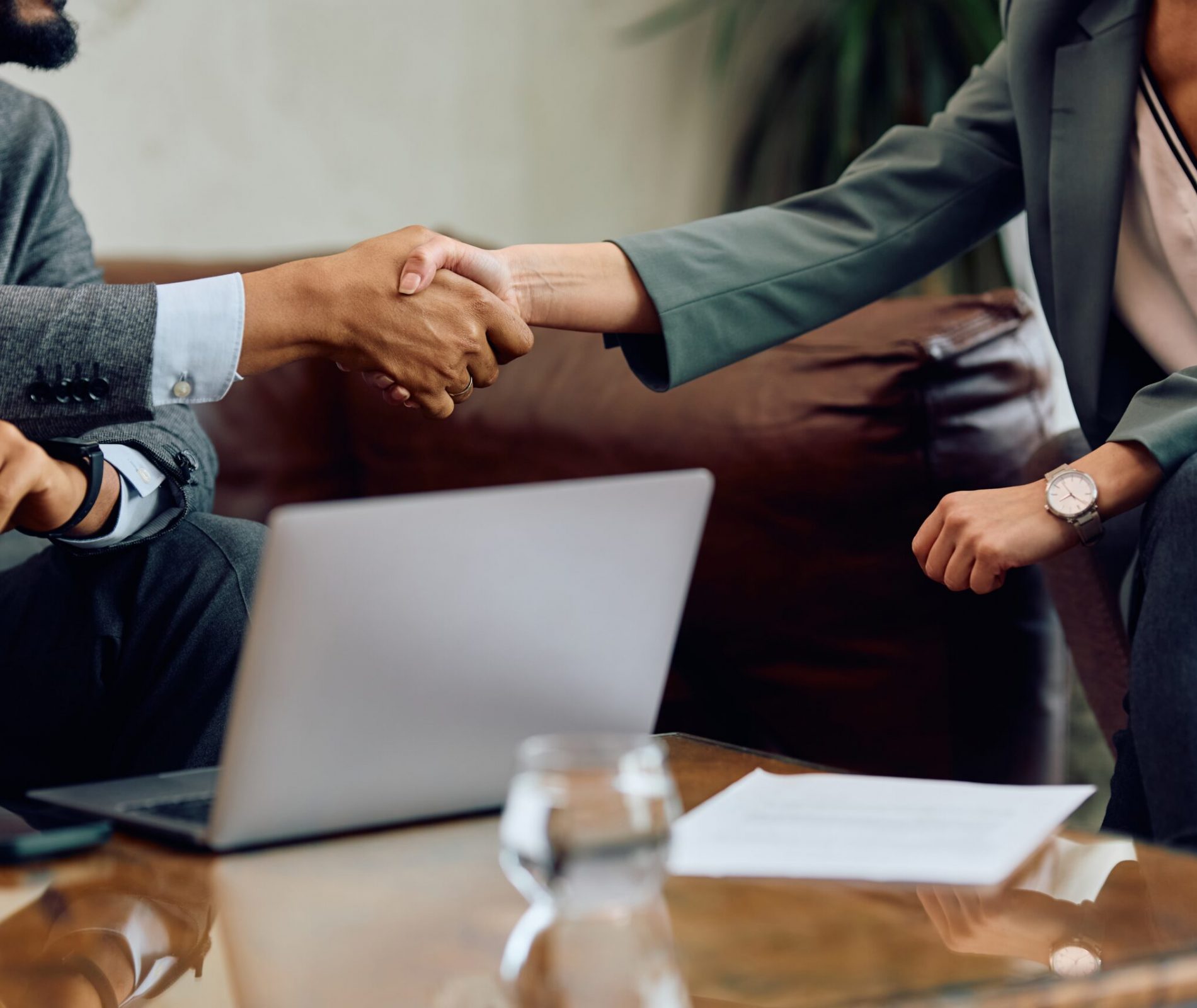 Close,Up,Of,Business,Colleagues,Shaking,Hands,During,A,Meeting. Close,Up,Of,Business,Colleagues,Shaking,Hands,During,A,Meeting.